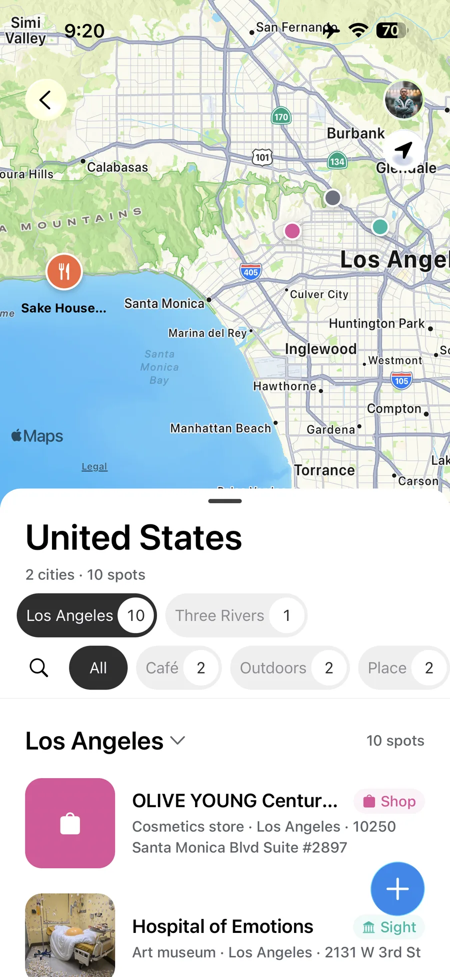 Wayfolio map screen showing saved places across Los Angeles with a country sheet and filters